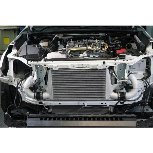 High Performance Diesel HPD N80 front mount intercooler upgrade kit installed on a 2020 vehicle, showcasing the intercooler and piping.