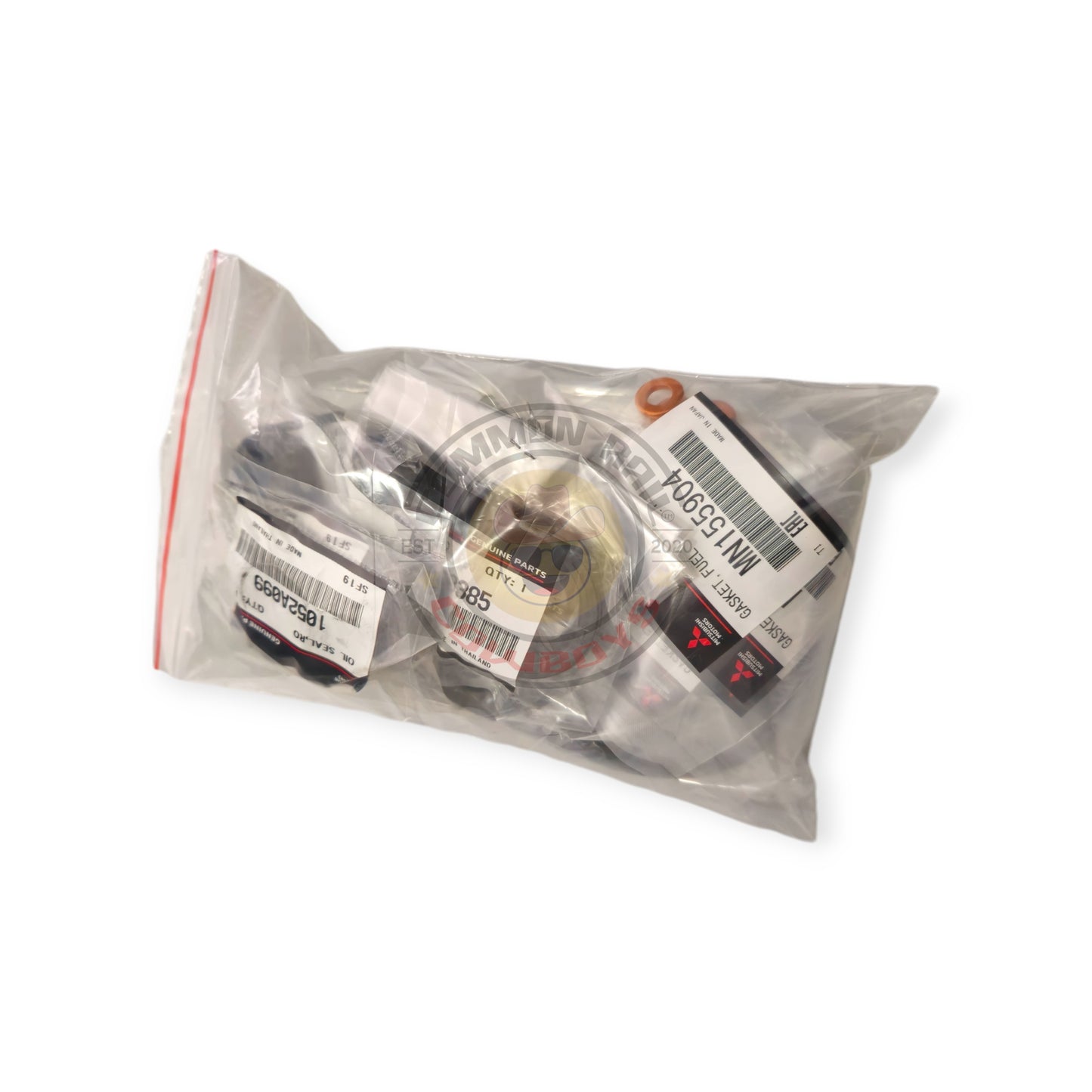 Mitsubishi 4M41 3.2L injector and rocker cover fitting kit with engine components and fittings in view.