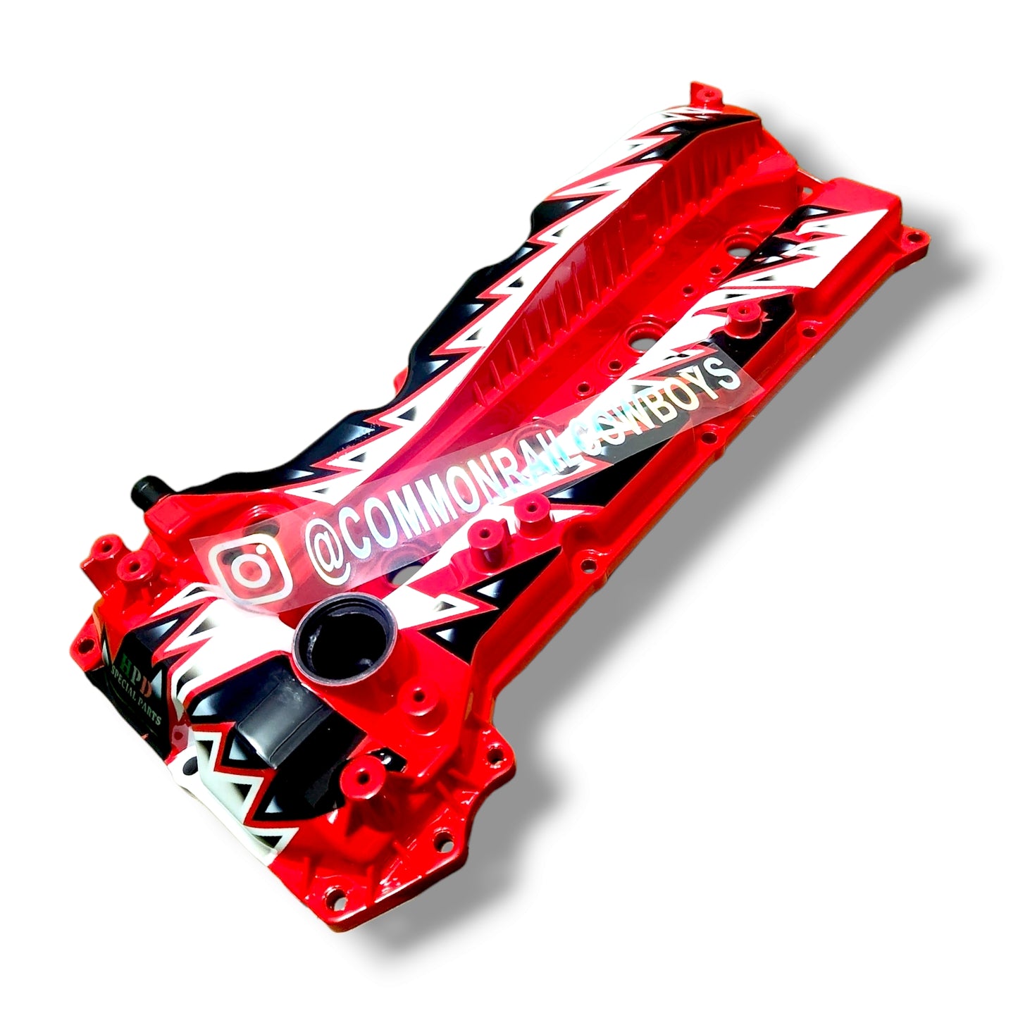 HPD Special Parts 1GD rocker cover showcasing black metal finish and detailed design for automotive engine protection.