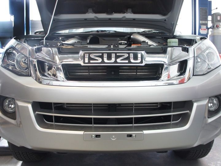 High Performance Diesel intercooler kit for Isuzu D-Max and MUX 2012-2016, showing the intercooler with hoses and mounting hardware.