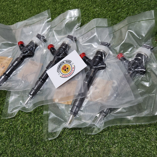 Denso Prado +30 diesel injectors for 1KD engine with 18 upgrade code, showing detailed view of injector nozzles and body.