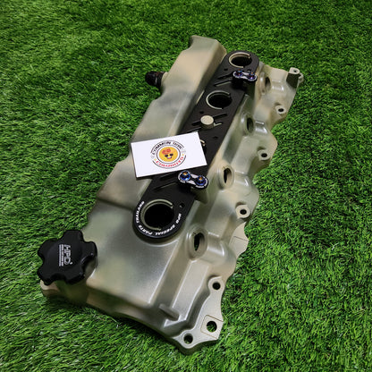 Camo alloy rocker cover for engine by Common Rail Cowboys, showing detailed camouflage design and polished metal finish.