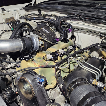 PKS 44mm high mount turbo kit with polished metal components and integrated piping for enhanced engine performance.
