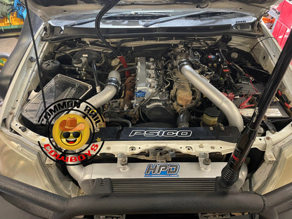 High Performance Diesel N70 Hilux Series 2 intercooler kit installed on a Toyota Hilux, showing the large intercooler core and piping.
