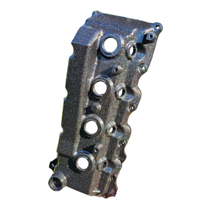 Colorful 1KD aluminium rocker cover for diesel engines, branded Common Rail Cowboys, with a sleek, polished finish.