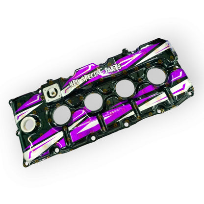 HPD Special Parts aluminium rocker cover for engine, featuring a sleek, durable design with visible mounting points.