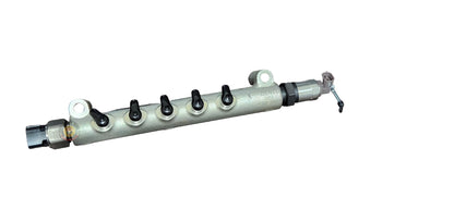 Toyota 1KD fuel rail for diesel engines, part 23810-30100, shown in a close-up image highlighting its metal construction.