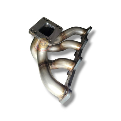 Stainless steel 1KD T3/T4 exhaust manifold by PPRC, showing the detailed cast metal design with mounting ports and flange.