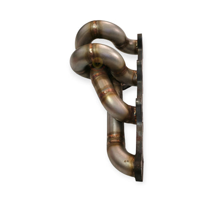 Toyota 1KD-FTV low mount exhaust manifold by PPRC, made of stainless steel, shown with detailed metal surface and mounting points.