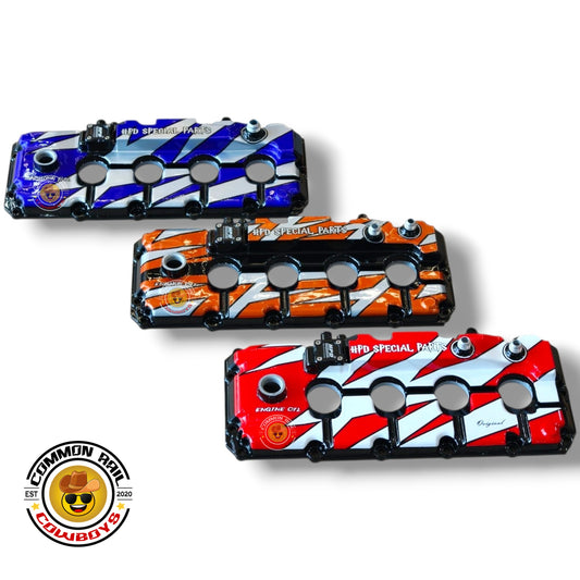 HPD Special Parts Euro 4 4JJ1 aluminum rocker cover for engine, featuring a sleek metallic finish and detailed design.