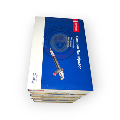 Denso Navara D40 YD25 fuel injectors with metal tips and electrical connectors, designed for diesel engine performance.