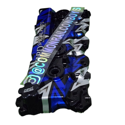 HPD Special Parts 1KD Alloy Rocker Cover, sleek metallic finish, designed for Toyota 1KD engine, detailed close-up image.