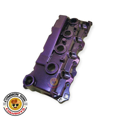 Colorful aluminium rocker cover for engine by Common Rail Cowboys, showcasing a sleek, polished finish and vibrant coloured accents.