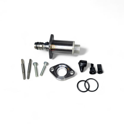 Toyota 1KD SCV suction control valve with adapter plate, showing metal valve component and mounting hardware.