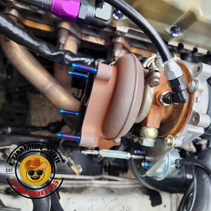 Titanium manifold studs for F44/F55 BMW, designed by Common Rail Cowboys, showing the shiny, durable studs on a white background.