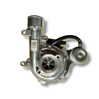 Common Rail Cowboys 1KD Boost 44mm turbocharger, metal turbine housing and compressor wheel, components ready for installation.