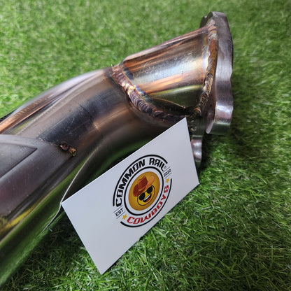 PPRC Hilux 1KD high mount dump pipe with 44mm F55 turbo, showing the chrome metal pipe and mounting flange on a vehicle.