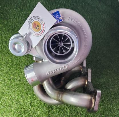 Greddy N70 Hilux F55 high-mount turbo kit installed on 1KD-FTV engine, showing turbo components and piping.