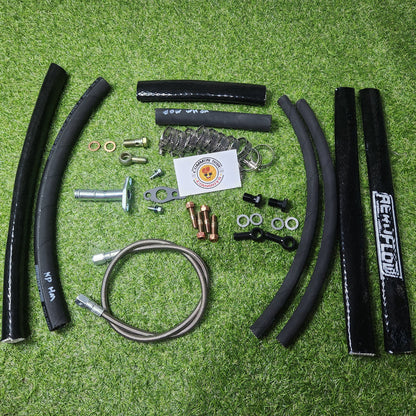 Greddy N70 Hilux F55 high-mount turbo kit installed on 1KD-FTV engine, showing turbo components and piping.